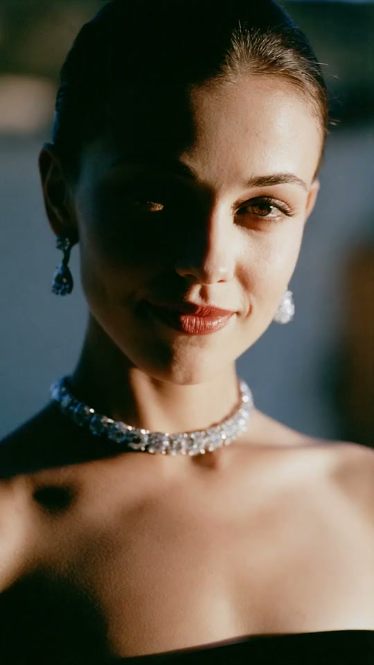 Moody diamond necklace close-up with dramatic shadow